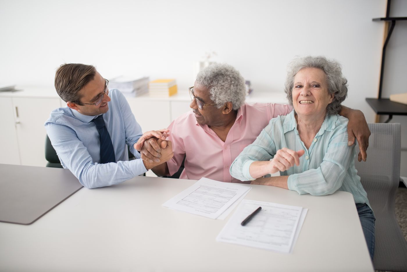 A Kester Insurance advisor meeting with happy clients
